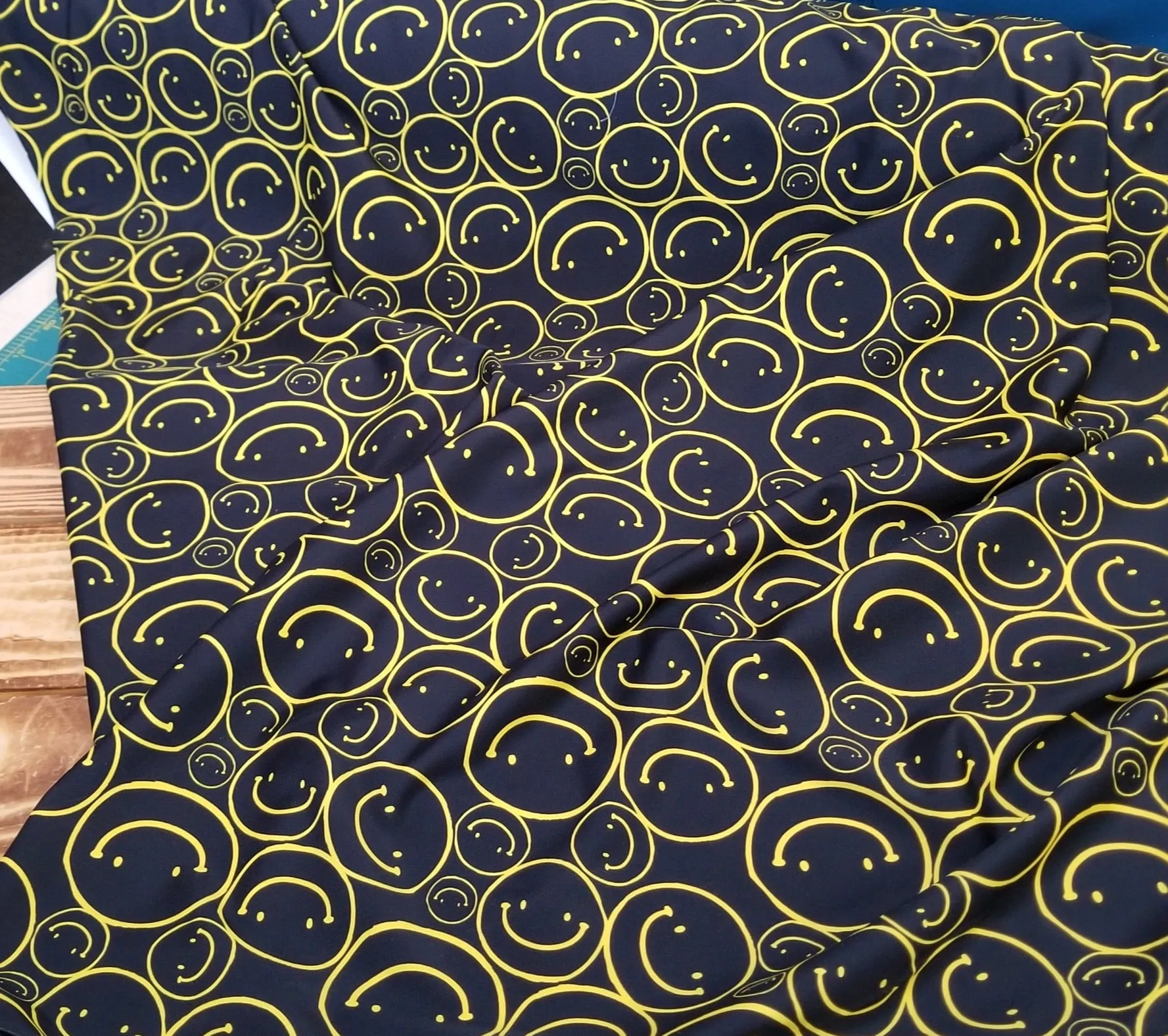 End of Bolt: 1.5 yards of Designer Deadstock Nylon Spandex Swim Performance Wear All Smiles Black and Yellow Conversational Knit- remnant